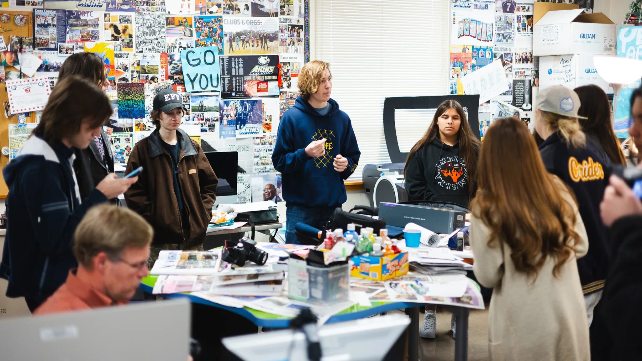 Student presenting creative portfolio at a professional showcase