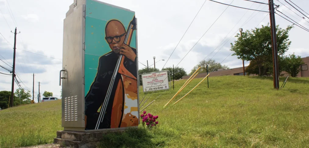 Landscape image of Truth's mural of Draylen Mason on side of electrical box in East Austin, TX.